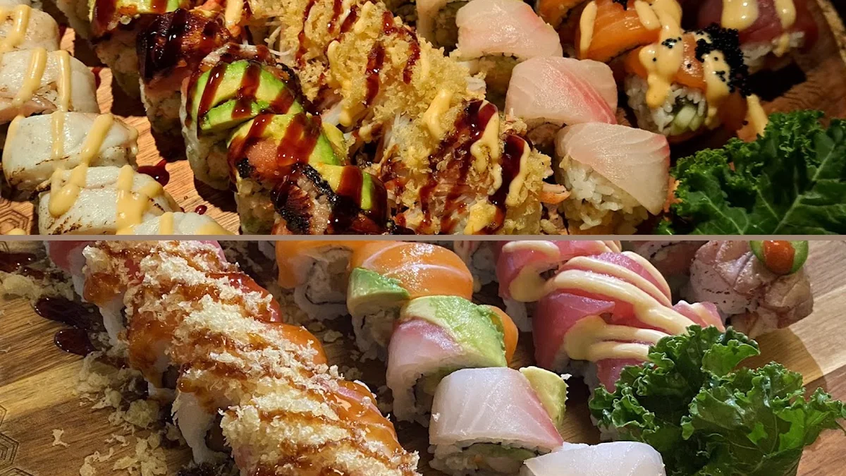 Sushi rolls arranged on a dark plate.