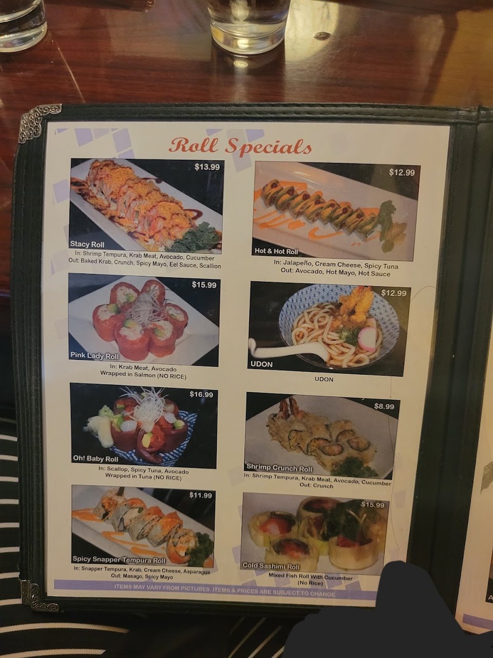 Menu page showing rolls and sashimi options.